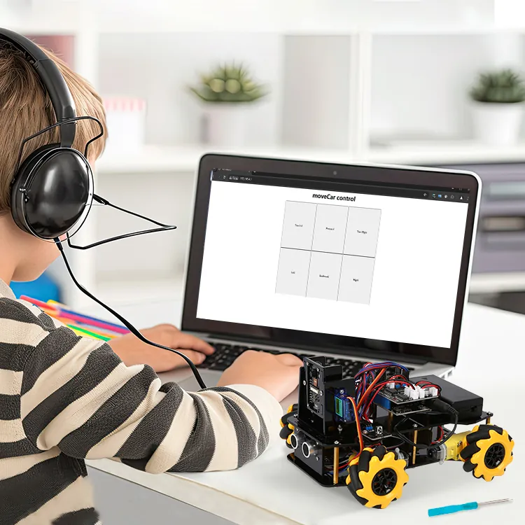 A child following a coding lesson on a laptop