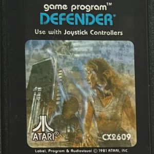 Defender Atari 2600 game cartridge with 1981 label featuring city skyline and figures artwork, used good condition.