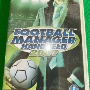 Football Manager Handheld 2007 PSP used game case with cover art showing manager holding soccer ball, Sega logo, PEGI 3+ rating.