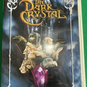 Jim Henson's The Dark Crystal PSP UMD Video case with fantasy cover art, showing wear and residue on top label.