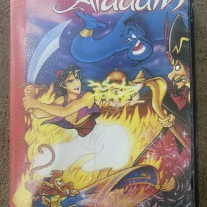 Used Aladdin Sega Mega Drive cartridge with colourful label showing Aladdin, Genie and Jafar amid flames, no case shown.