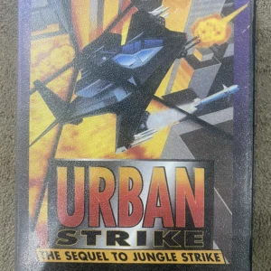 Urban Strike Sega Mega Drive cartridge with Electronic Arts label, sequel to Jungle Strike, used condition shown in black case.